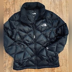 The North Face black down jacket. Hip length.